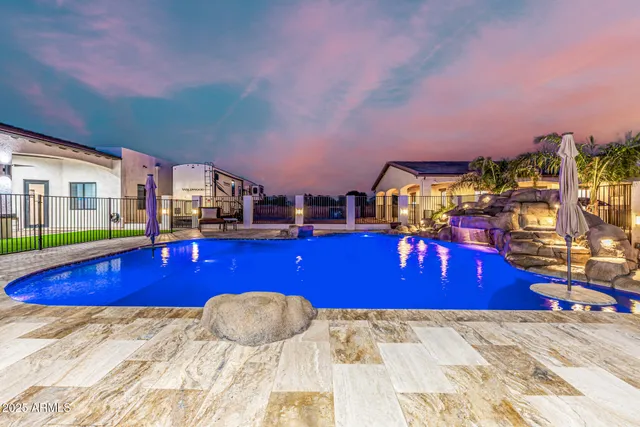 a view of green field with house in the background