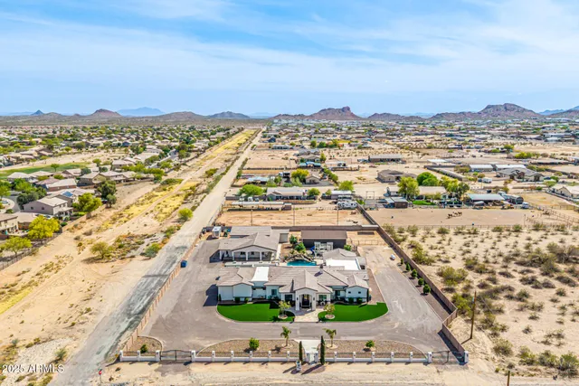a living room with furniture ceiling fan and a wooden floor