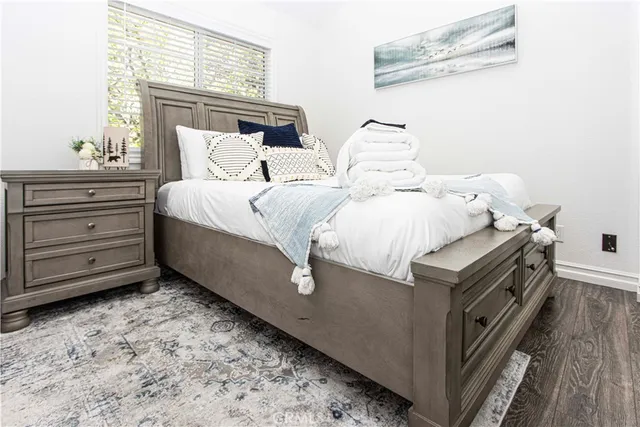 a bedroom with a bed and a dresser