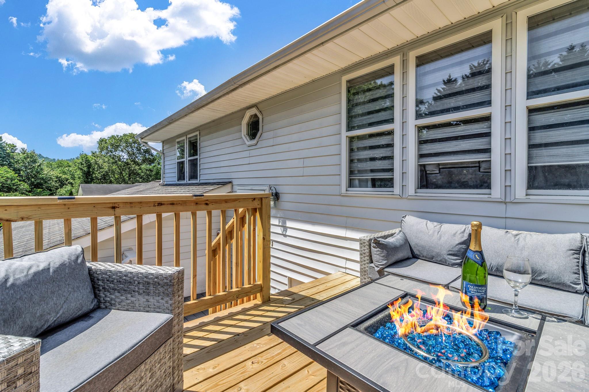 13 Spring Lake Drive Fletcher, NC 28732 - Photo 4 of 30 a roof deck with wooden floor and furniture