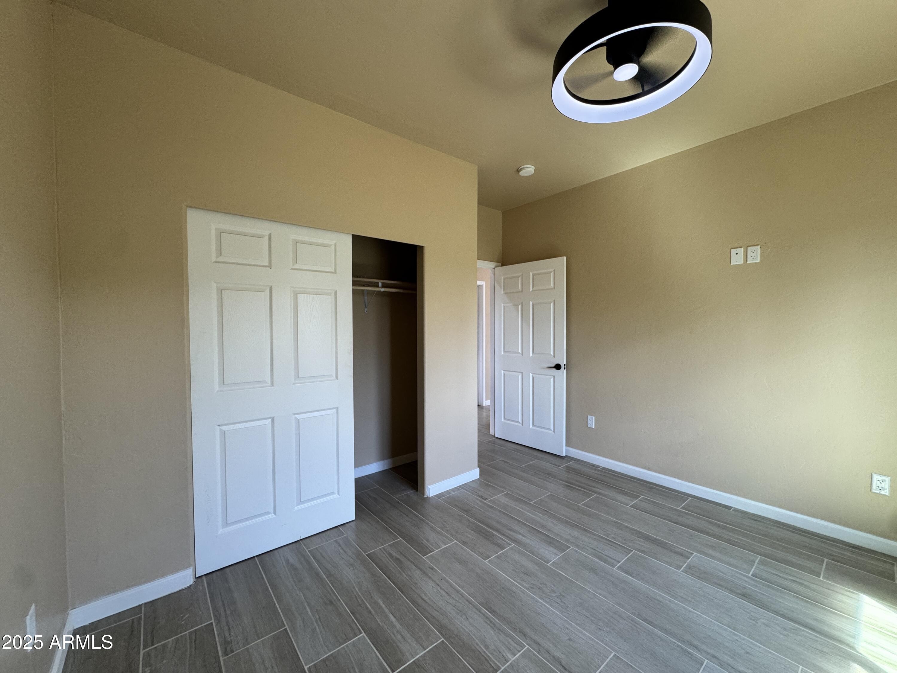 1457 East 23rd Street Douglas, AZ 85607 - Photo 11 of 23 a view of empty room with wooden floor