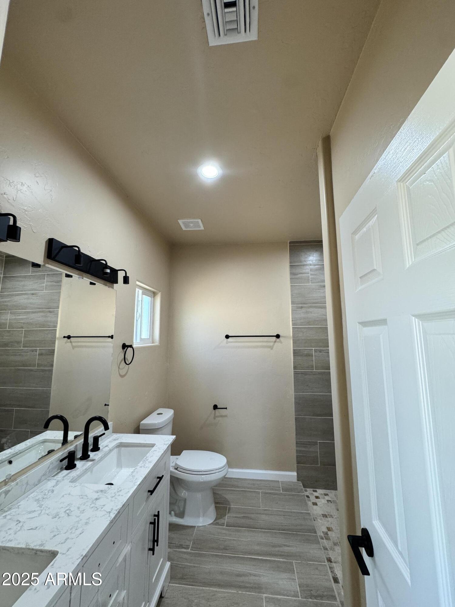 1457 East 23rd Street Douglas, AZ 85607 - Photo 17 of 23 a bathroom with a sink a toilet and shower