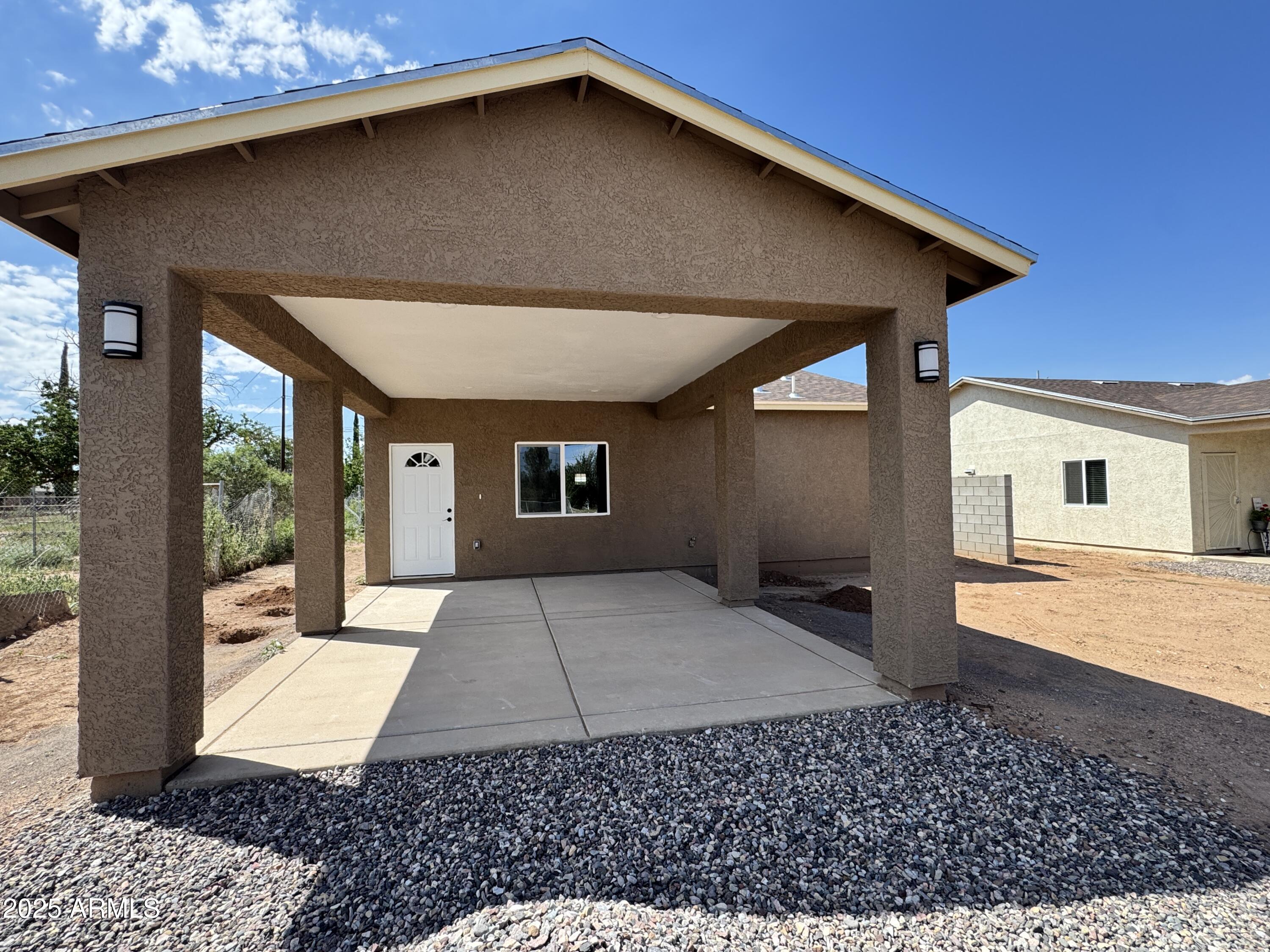 1457 East 23rd Street Douglas, AZ 85607 - Photo 2 of 23 a front view of a house with a yard