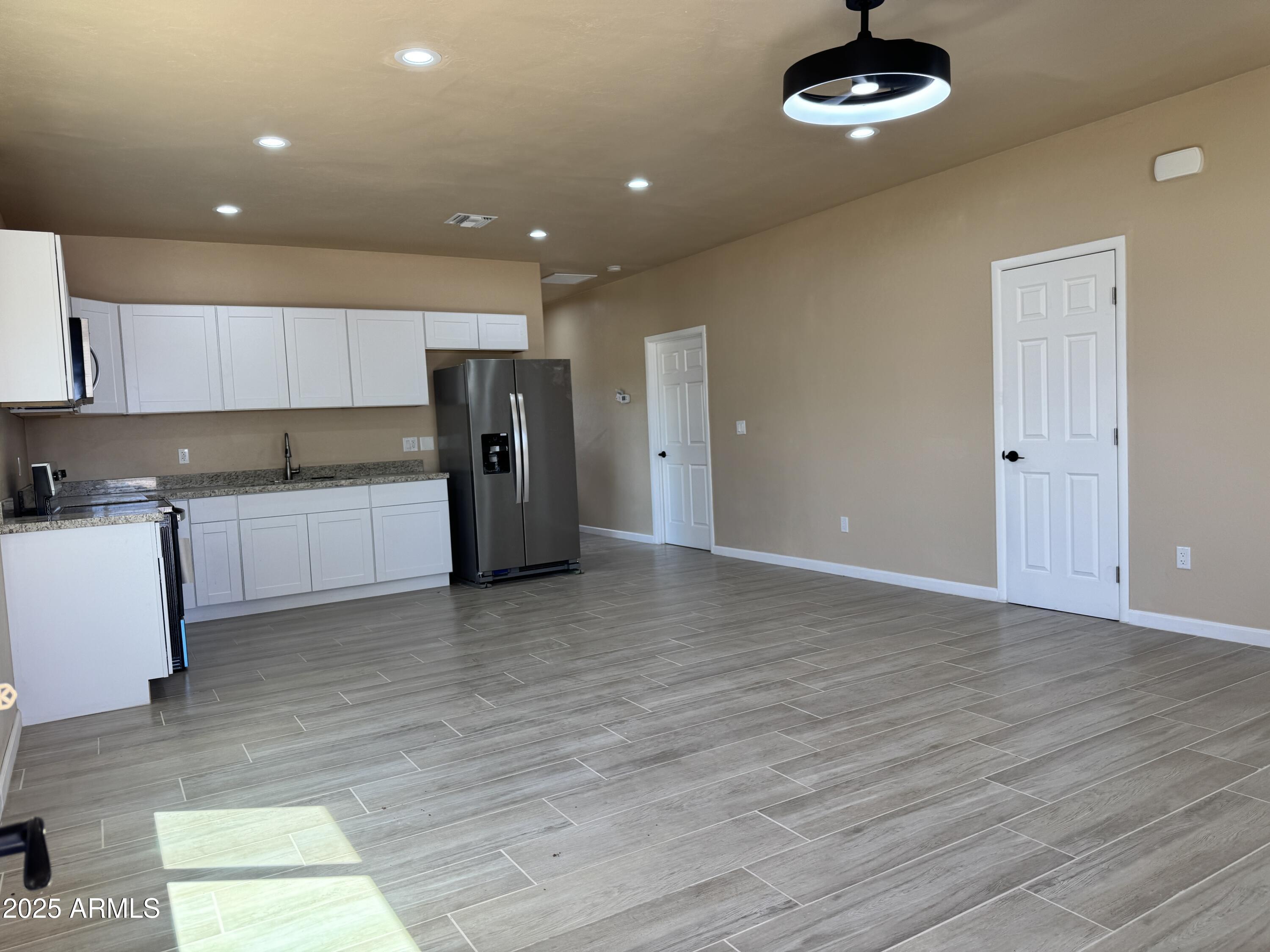 1457 East 23rd Street Douglas, AZ 85607 - Photo 3 of 23 a view of a kitchen with a sink and a refrigerator