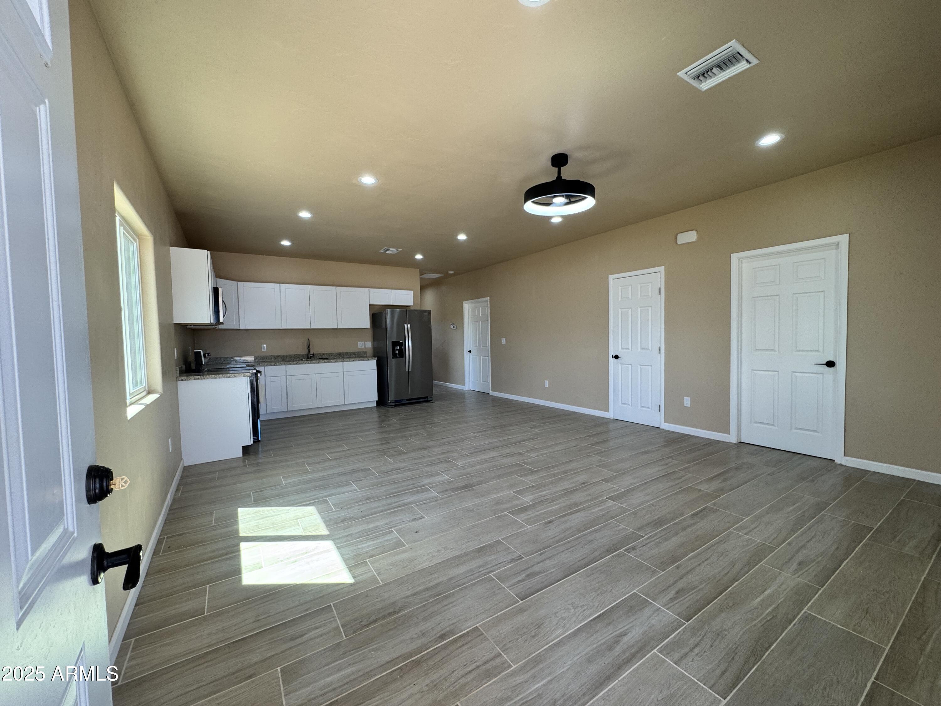 1457 East 23rd Street Douglas, AZ 85607 - Photo 4 of 23 a view of kitchen with cabinets and wooden floor