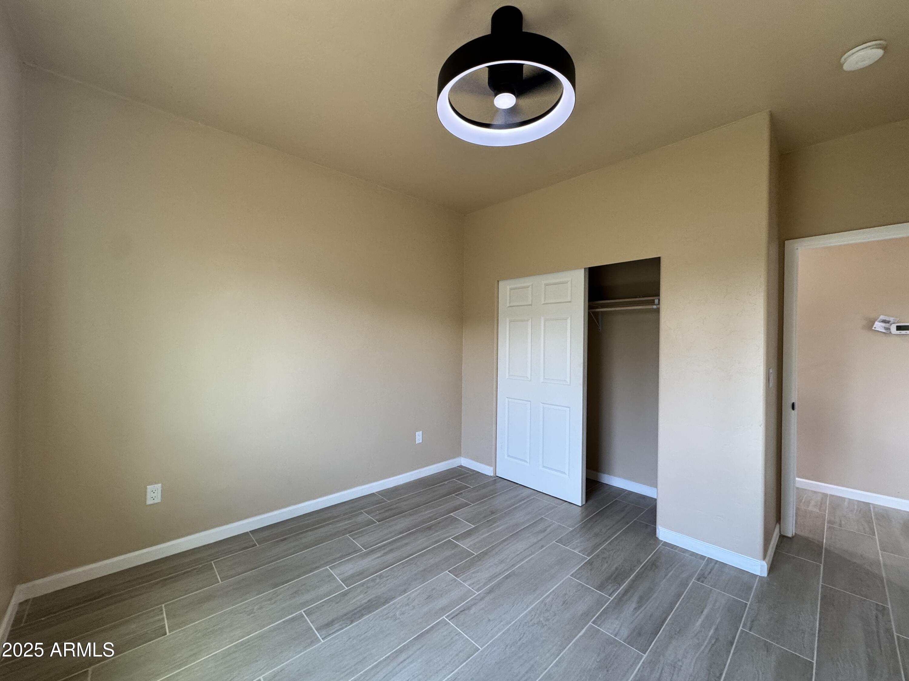 1457 East 23rd Street Douglas, AZ 85607 - Photo 10 of 23 a view of an empty room and wooden floor