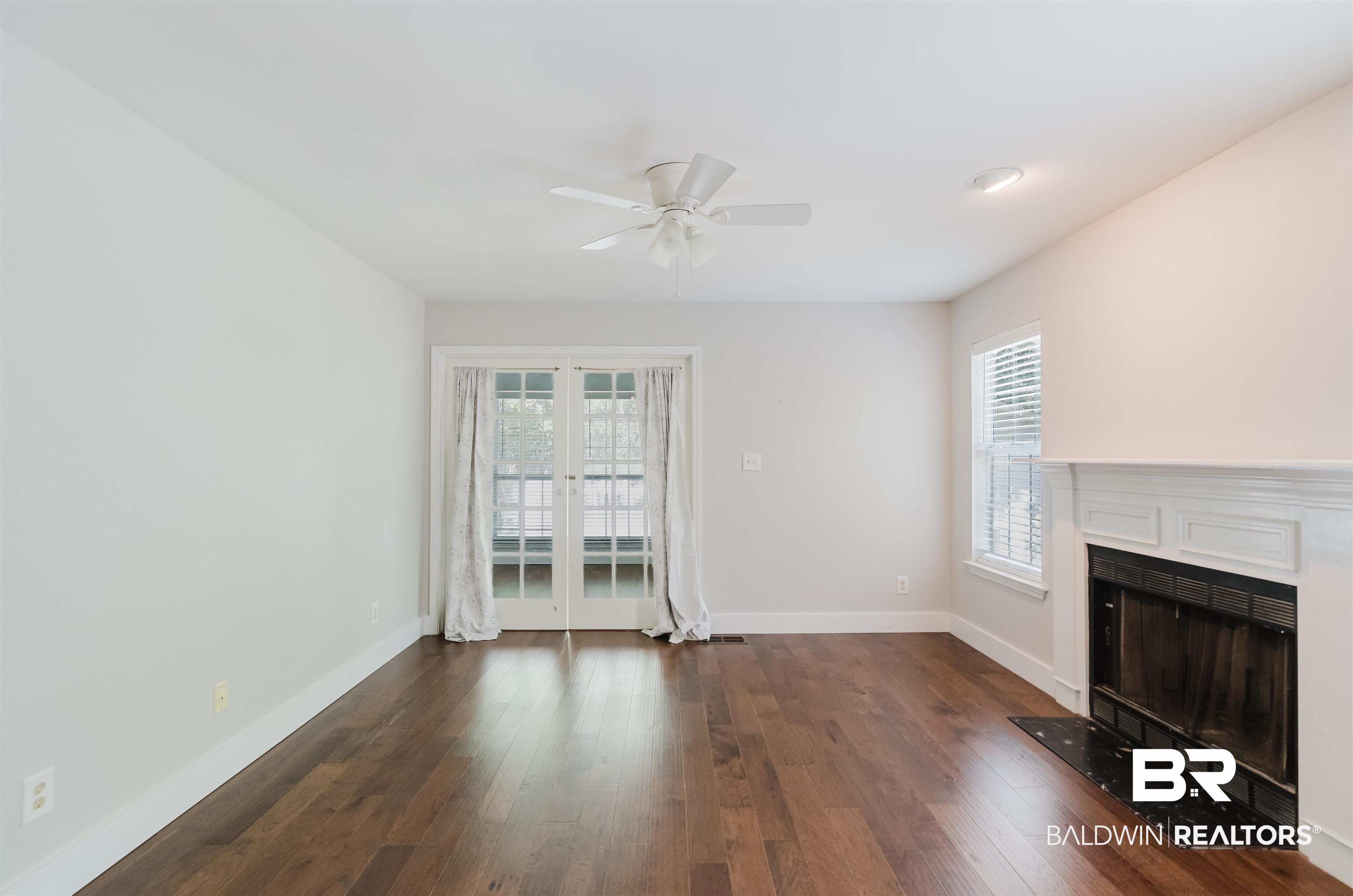 20460 Bishop Road Fairhope, AL 36532 - Photo 21 of 41 Unfurnished living room with plenty of natural light, ceiling fan, and dark wood finished floors