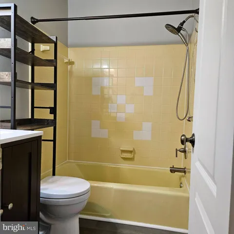 a bathroom with a shower and a toilet