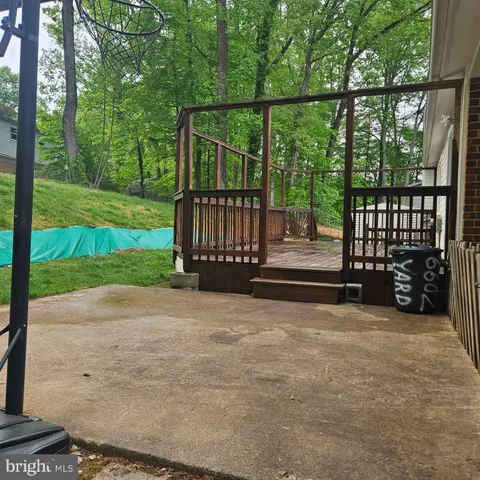 a view of a backyard with wooden fence