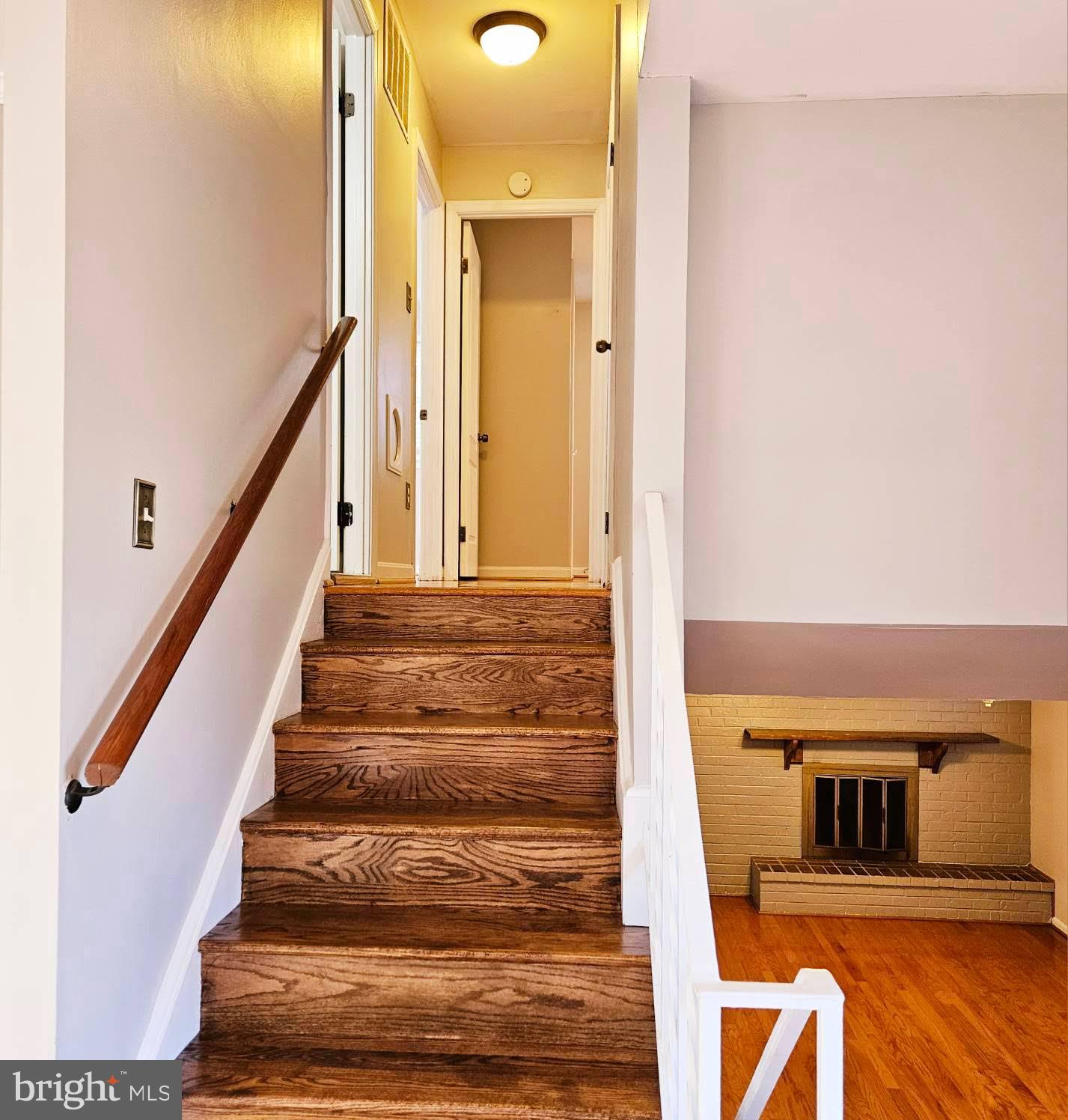 6602 Huntsman Boulevard Springfield, VA 22152 - Photo 7 of 14 a view of entryway and hall with wooden floor