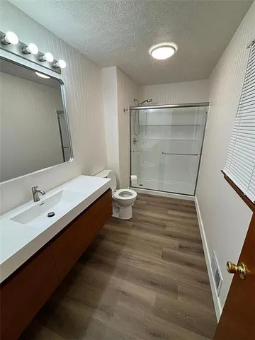 a bathroom with a double vanity sink and mirror