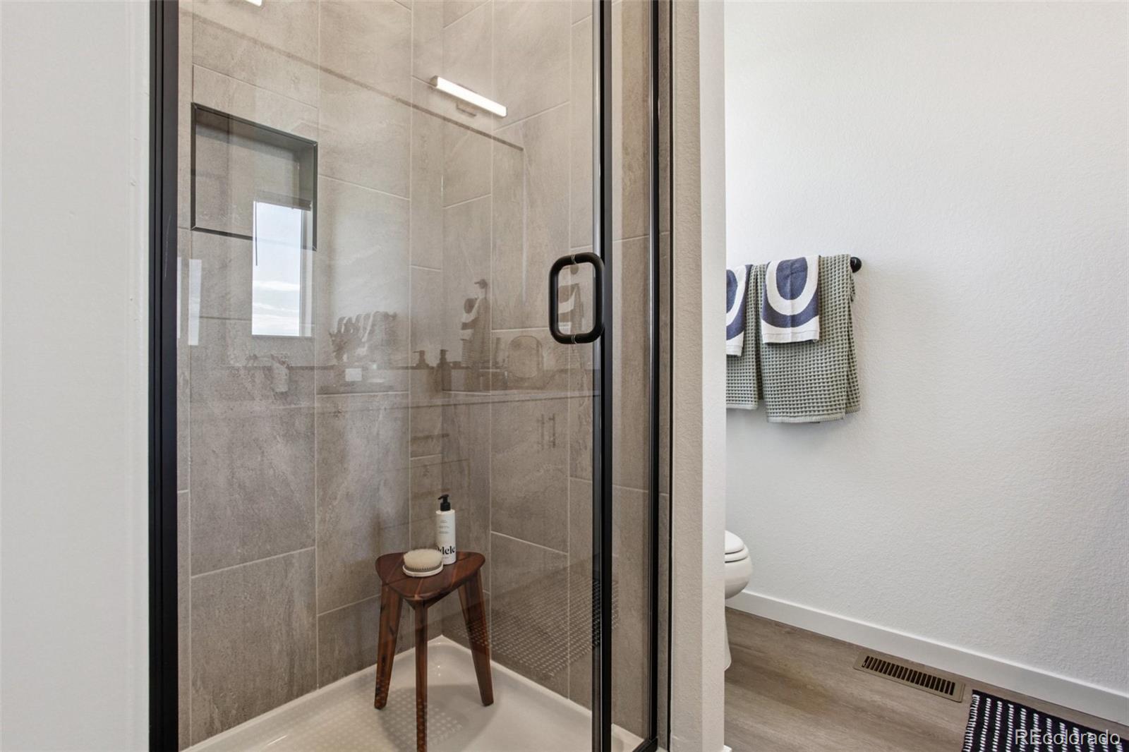 6441 Meade Way Arvada, CO 80003 - Photo 11 of 30 a bathroom with a shower