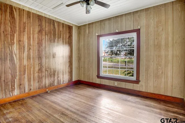 a kitchen with kitchen island granite countertop a sink cabinets and stainless steel appliances