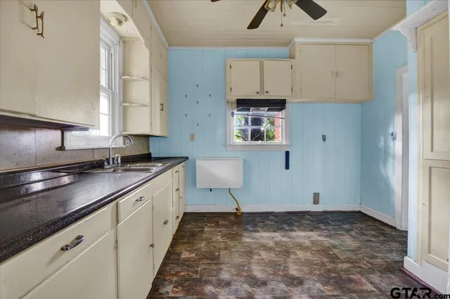 an empty room with wooden floor and closet