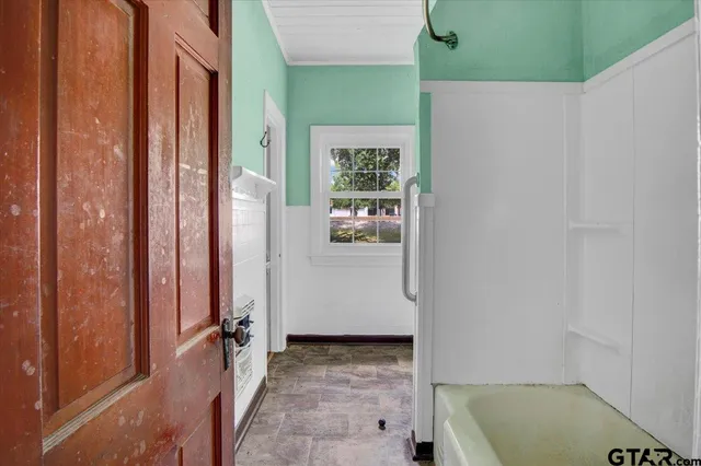 a bathroom with a sink mirror toilet and shower