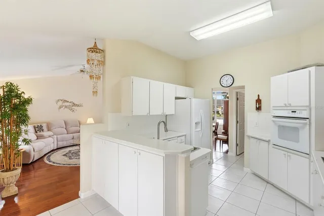 a kitchen with a refrigerator sink and stove