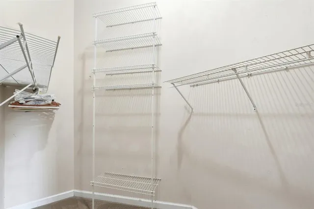 a bed room with a bed and a chandelier