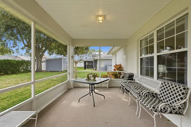 a view of a living room and floor to ceiling window