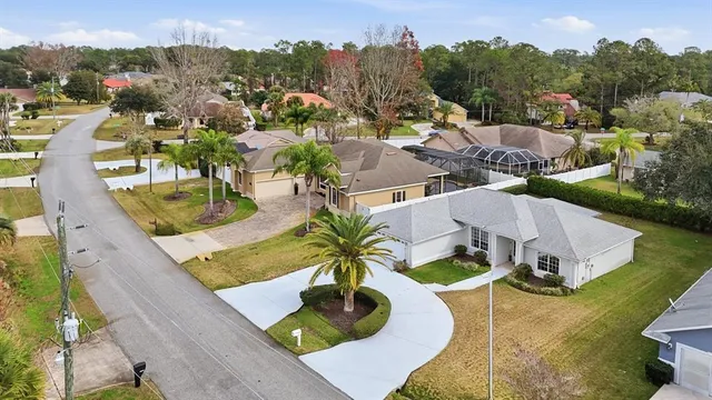 an aerial view of a house with swimming pool