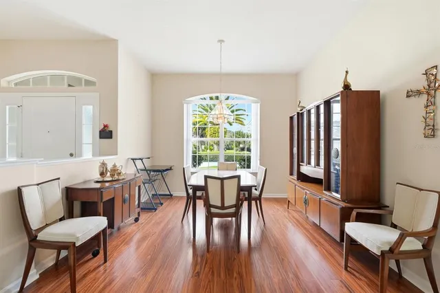 a dining room with furniture window wooden floor