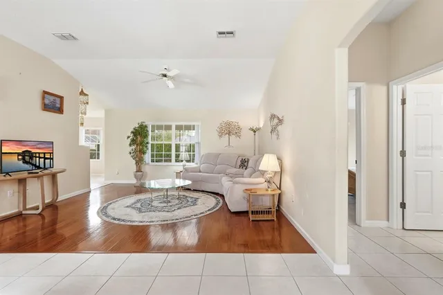 a living room with furniture and a table