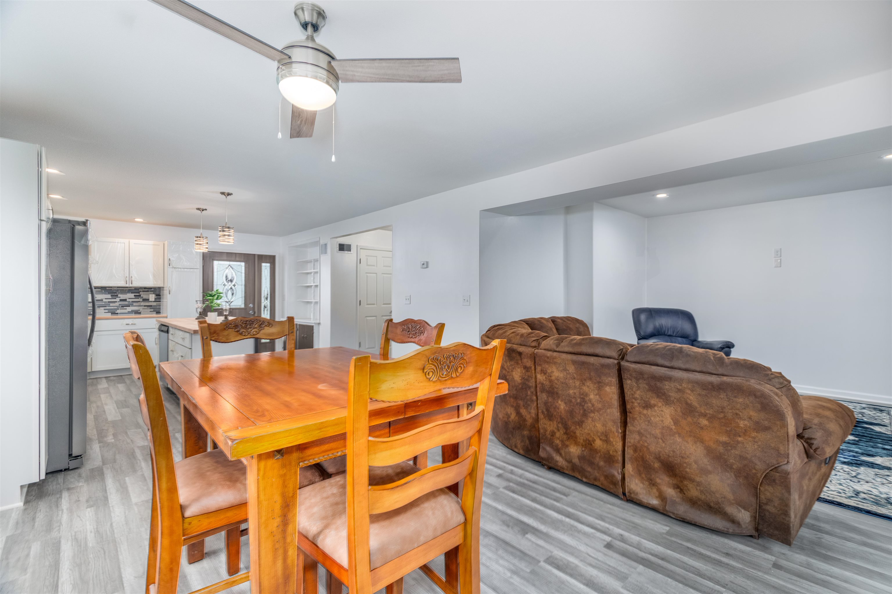 27 Astor Road Babbitt, MN 55706 - Photo 11 of 22 Dining to living room view Dining space featuring recessed lighting, light wood-type flooring, and ceiling fan