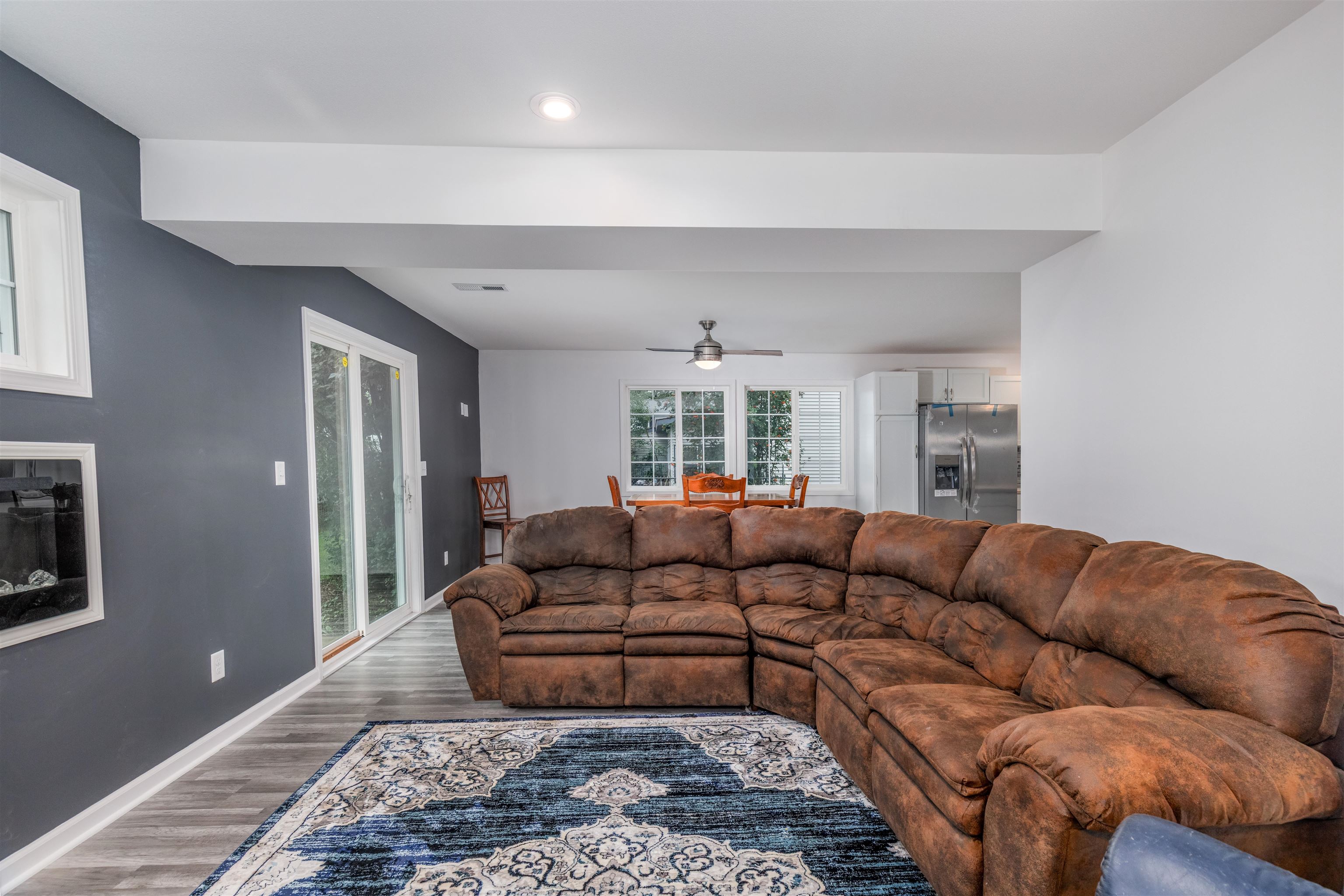 27 Astor Road Babbitt, MN 55706 - Photo 12 of 22 Living room to Dining view Living room with wood finished floors, ceiling fan, and recessed lighting