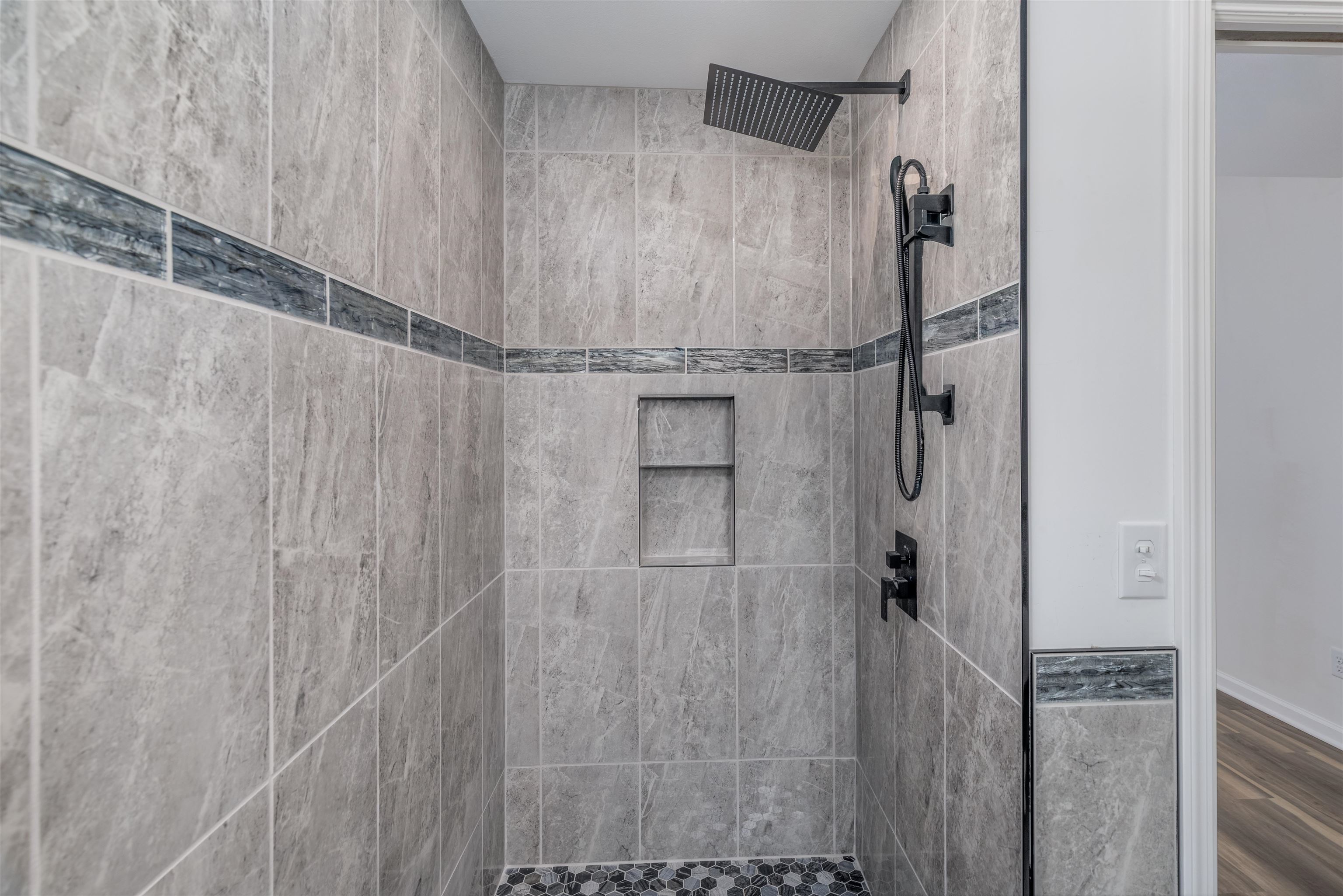 27 Astor Road Babbitt, MN 55706 - Photo 18 of 22 Primary Bathroom featuring a walk in tile shower