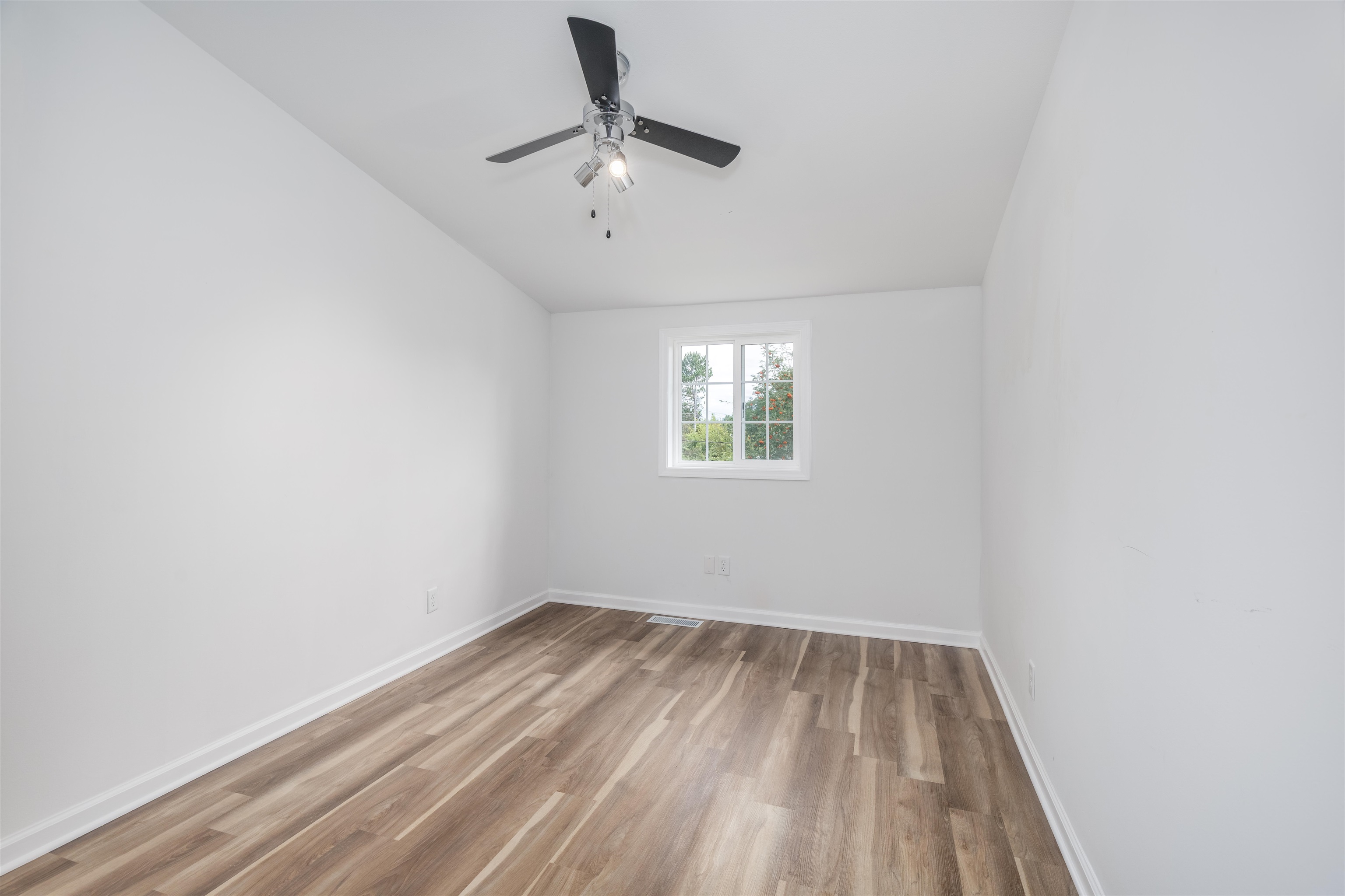27 Astor Road Babbitt, MN 55706 - Photo 20 of 22 Spare room featuring light wood finished floors and a ceiling fan