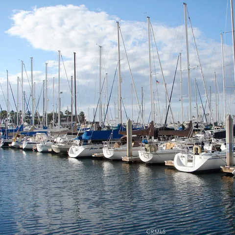 a view of a ocean with boats next to a dock