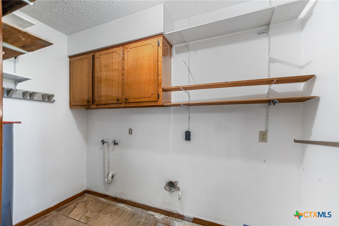 181 Pecan Street Port Lavaca, TX 77979 - Photo 11 of 34 a view of storage and utility room with two windows