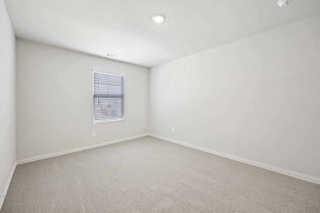 1737 Arches Road Anna, TX 75409 - Photo 28 of 38 an empty room with a empty space and window