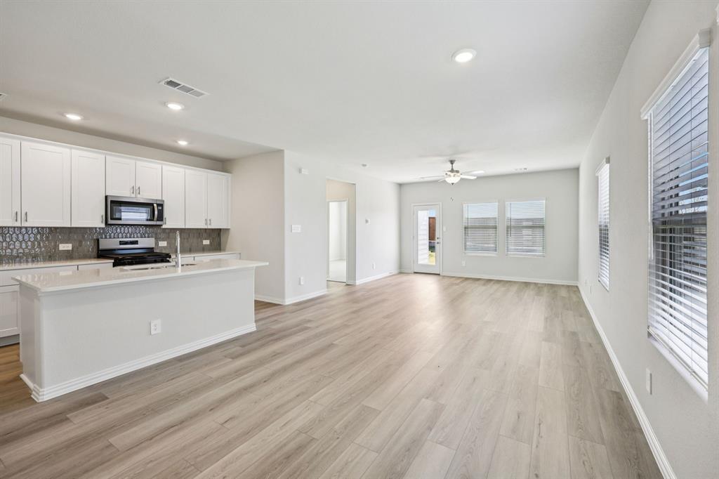 1737 Arches Road Anna, TX 75409 - Photo 3 of 38 a view of kitchen with sink and wooden floor