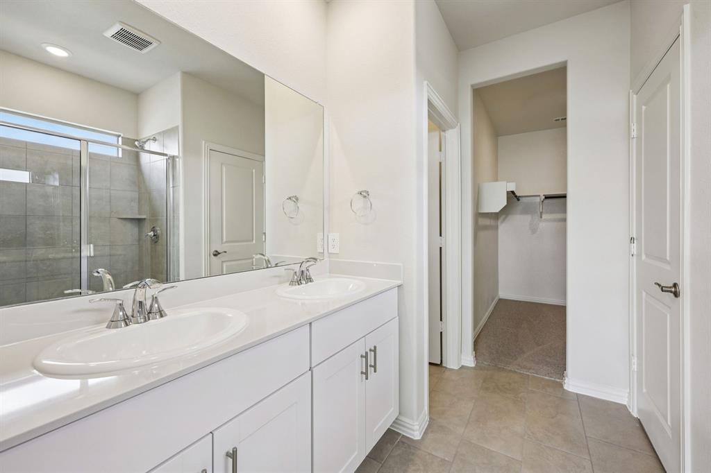 1737 Arches Road Anna, TX 75409 - Photo 31 of 38 a bathroom with a sink and a mirror