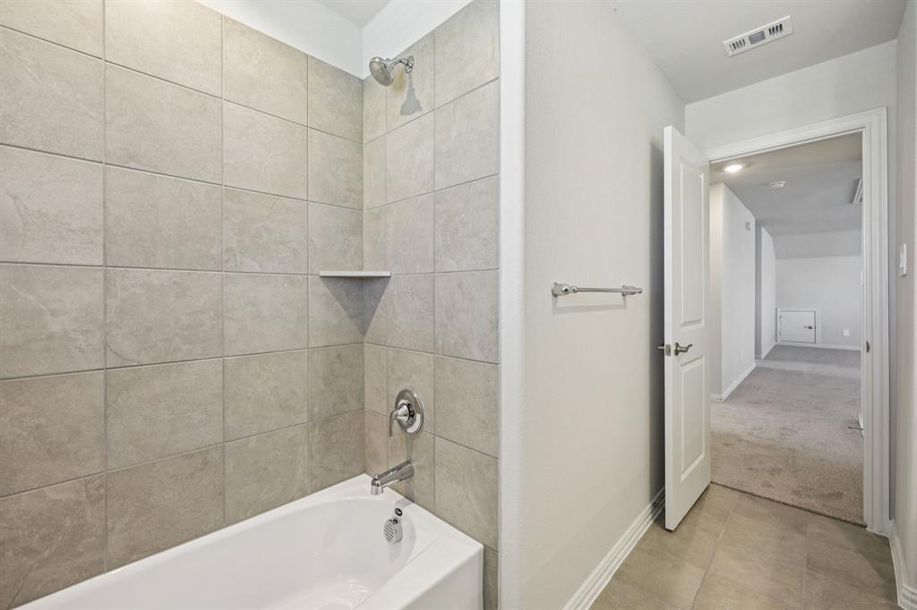 1737 Arches Road Anna, TX 75409 - Photo 36 of 38 a bathroom with a bathtub and a shower