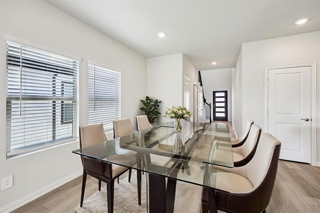 1737 Arches Road Anna, TX 75409 - Photo 10 of 38 a view of a dining room with furniture window and wooden floor