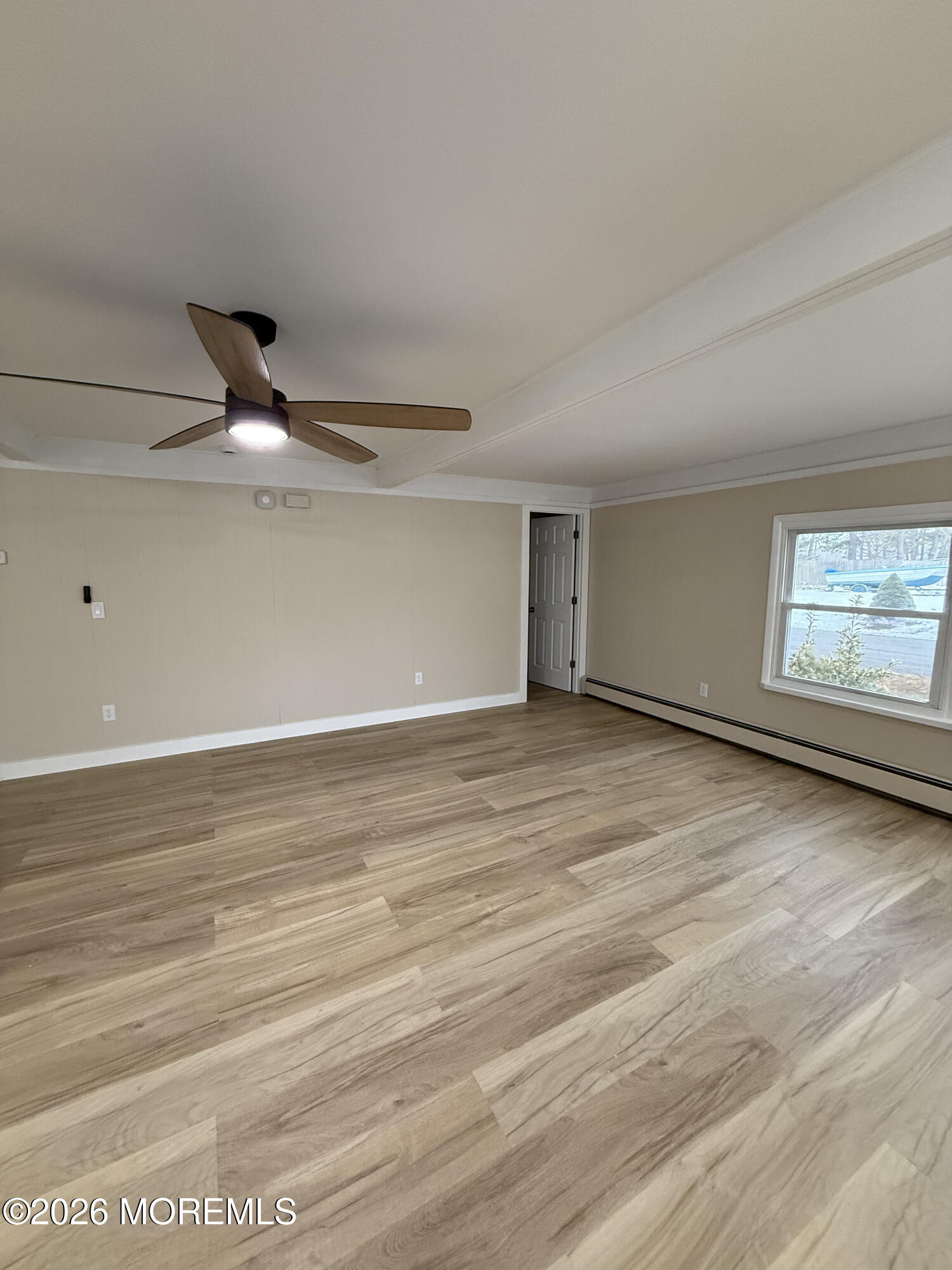 801 Pensacola Road Forked River, NJ 08731 - Photo 16 of 22 a view of an empty room with wooden floor and a window