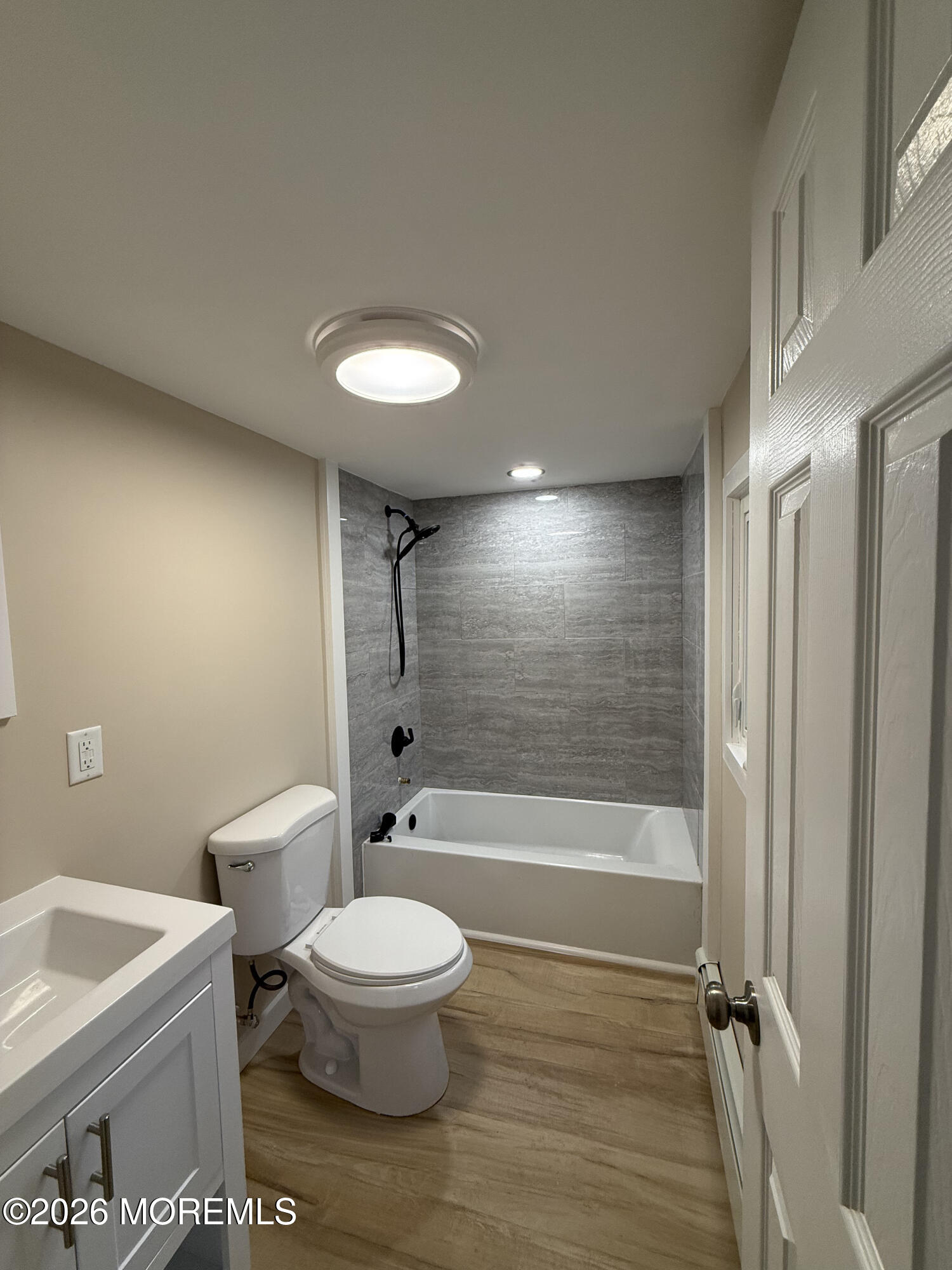 801 Pensacola Road Forked River, NJ 08731 - Photo 18 of 22 a bathroom with a toilet a sink and bathtub
