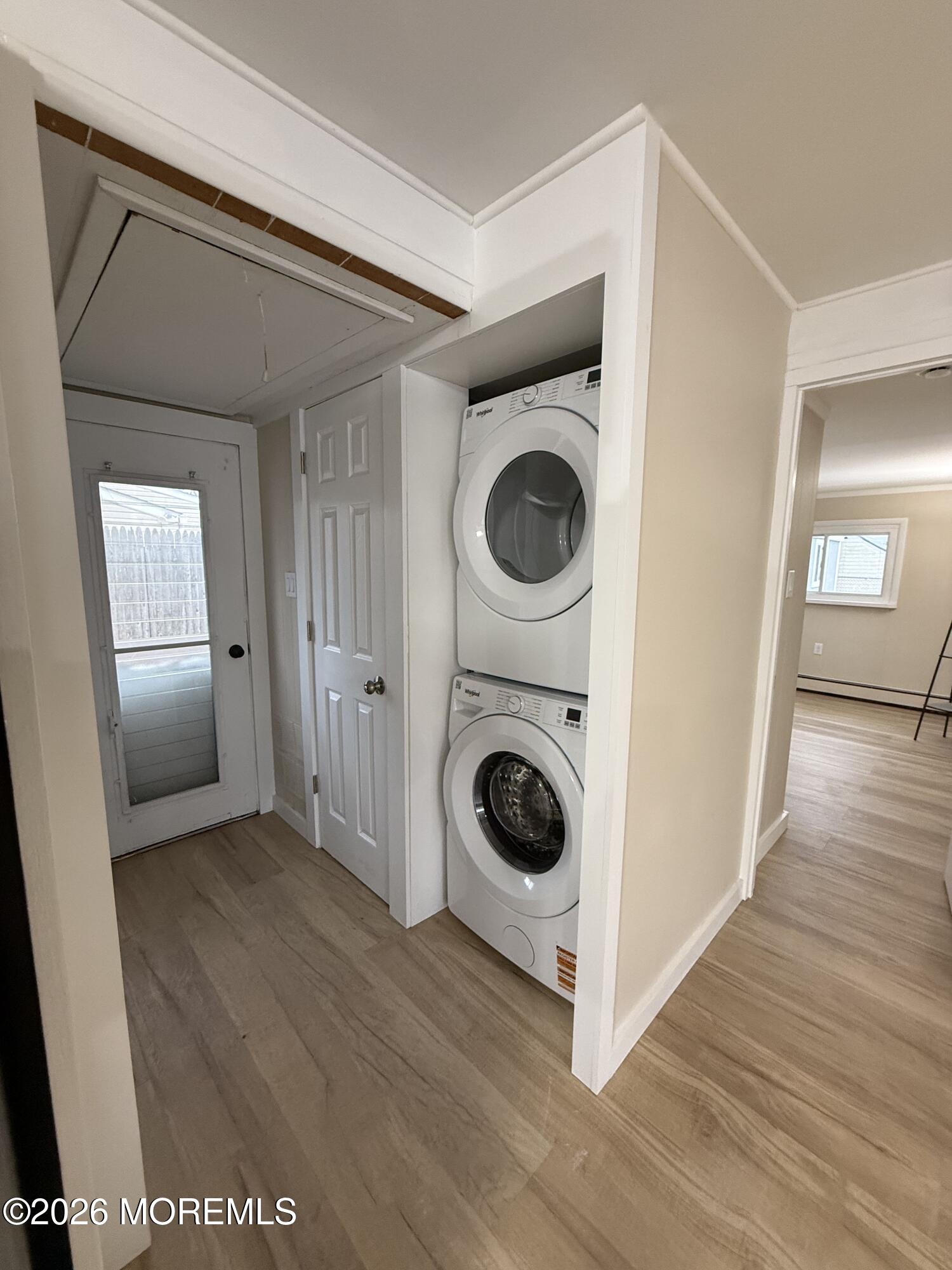 801 Pensacola Road Forked River, NJ 08731 - Photo 5 of 22 a view of a hallway with washer and dryer