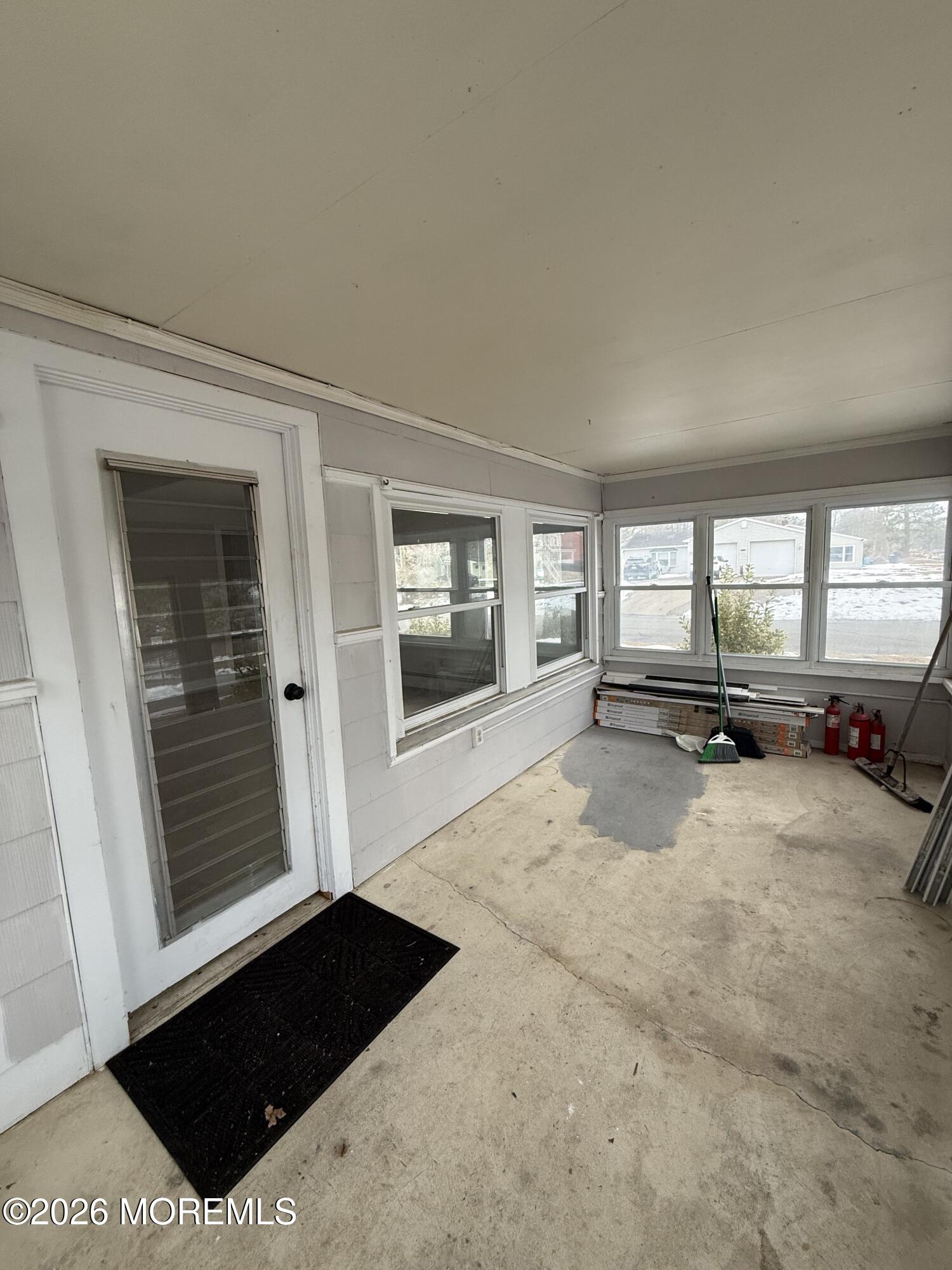 801 Pensacola Road Forked River, NJ 08731 - Photo 6 of 22 a living room with furniture and a large window