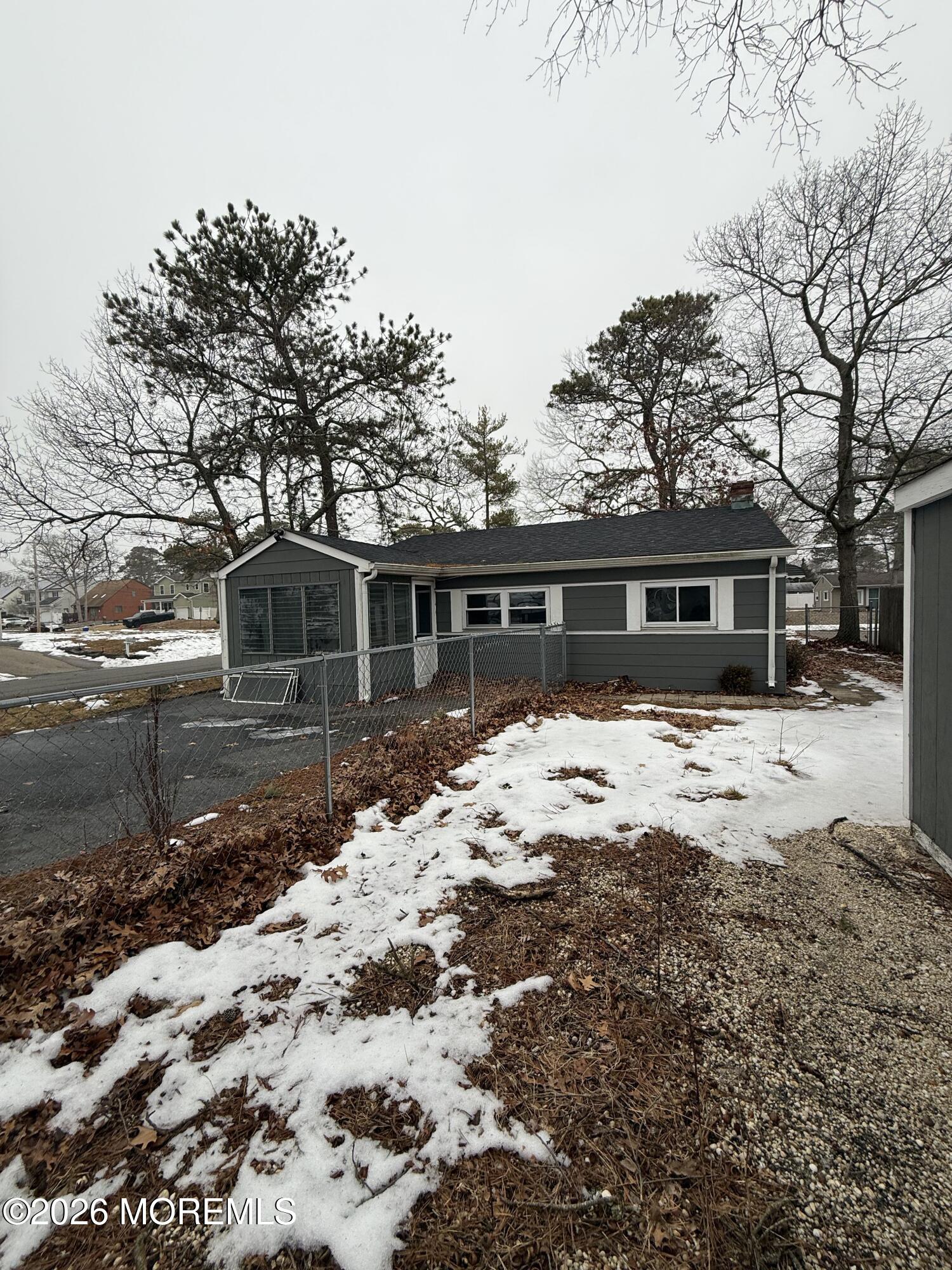 801 Pensacola Road Forked River, NJ 08731 - Photo 9 of 22 a front view of a house with a yard covered in snow
