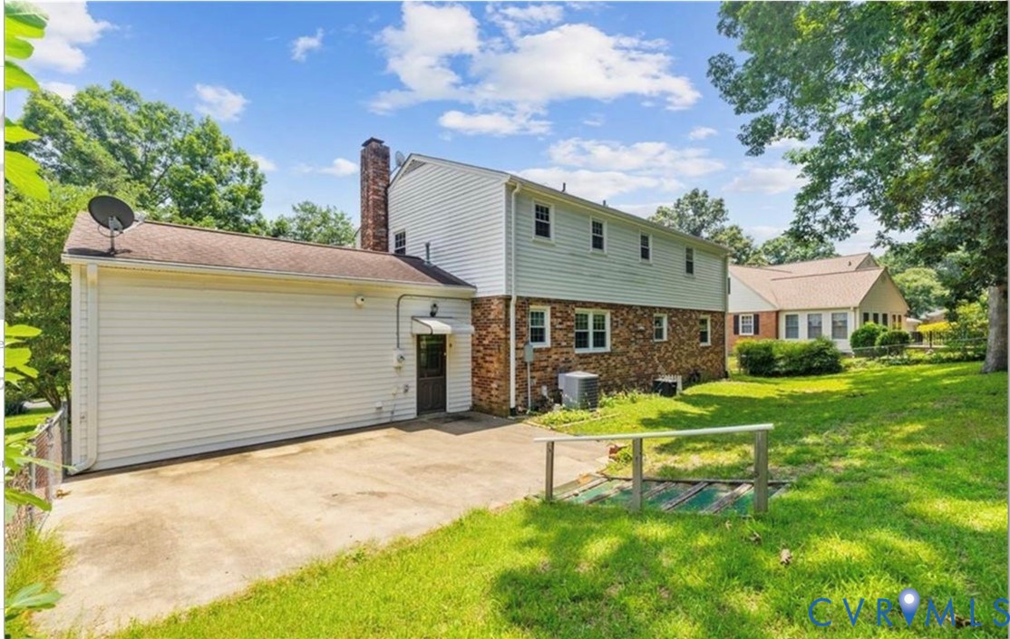 10920 Stepney Road Chester, VA 23831 - Photo 4 of 18 Back of house with a patio area, a chimney, and br