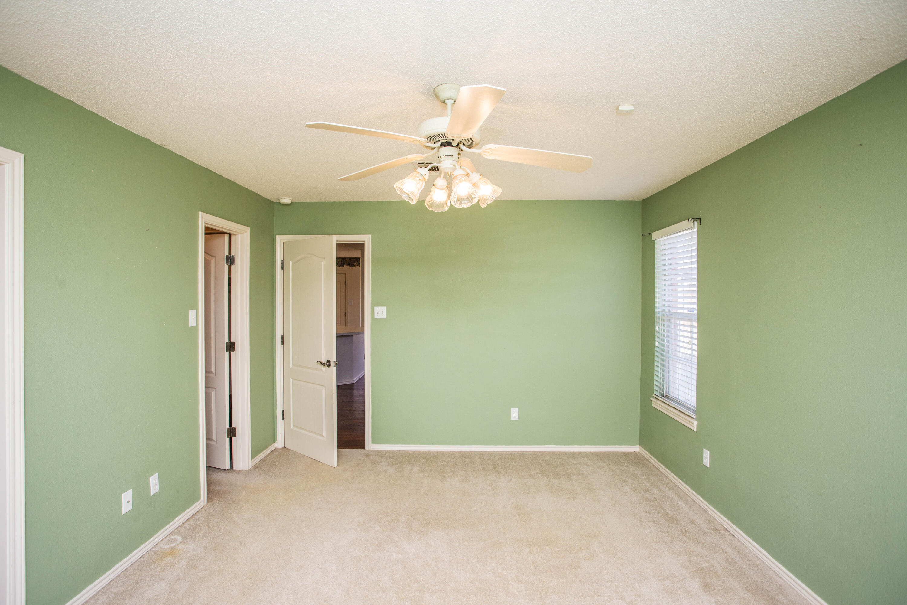 1904 76th Street Lubbock, TX 79423 - Photo 18 of 32 a view of an empty room with a window