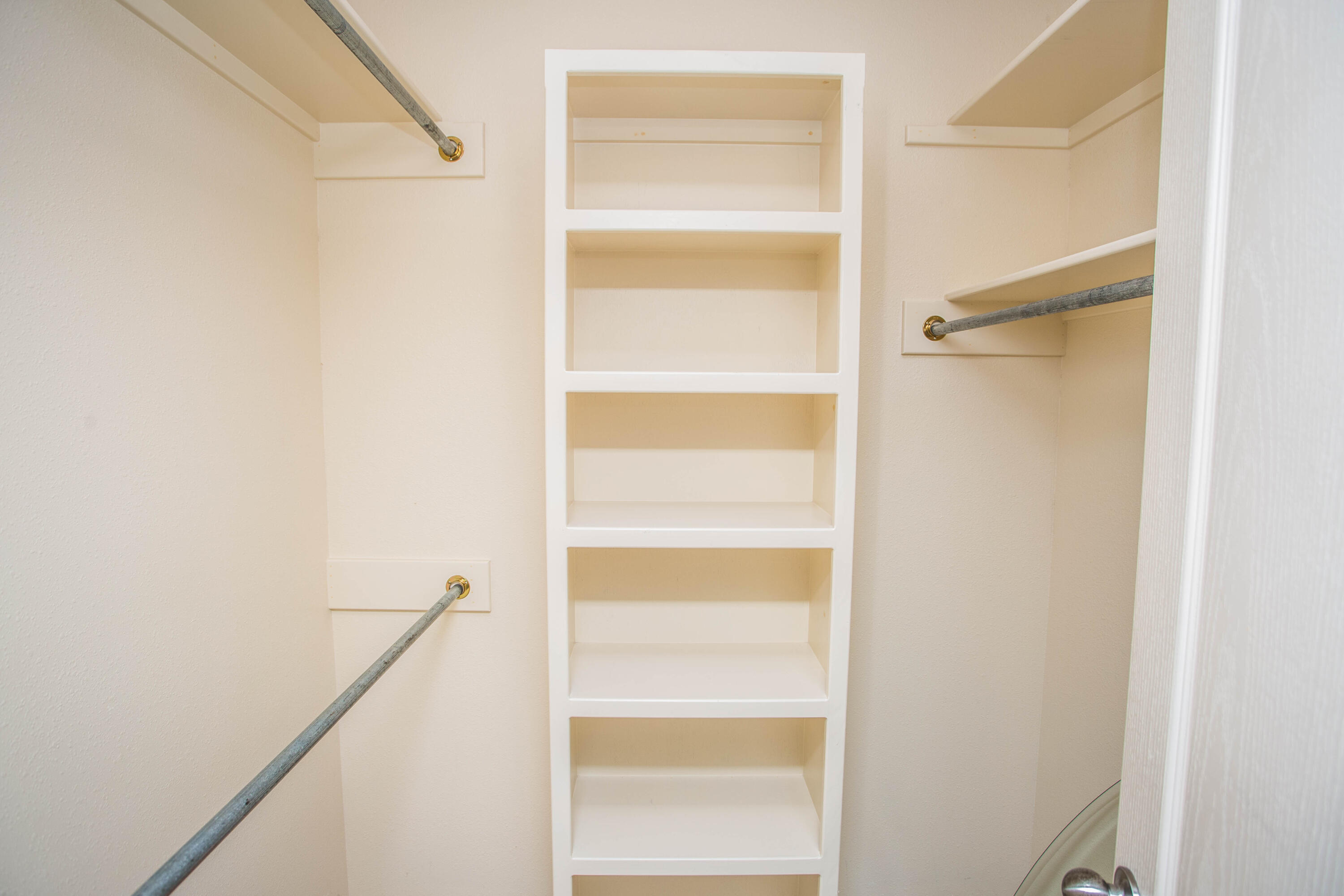 1904 76th Street Lubbock, TX 79423 - Photo 22 of 32 a view of walk in closet with empty racks