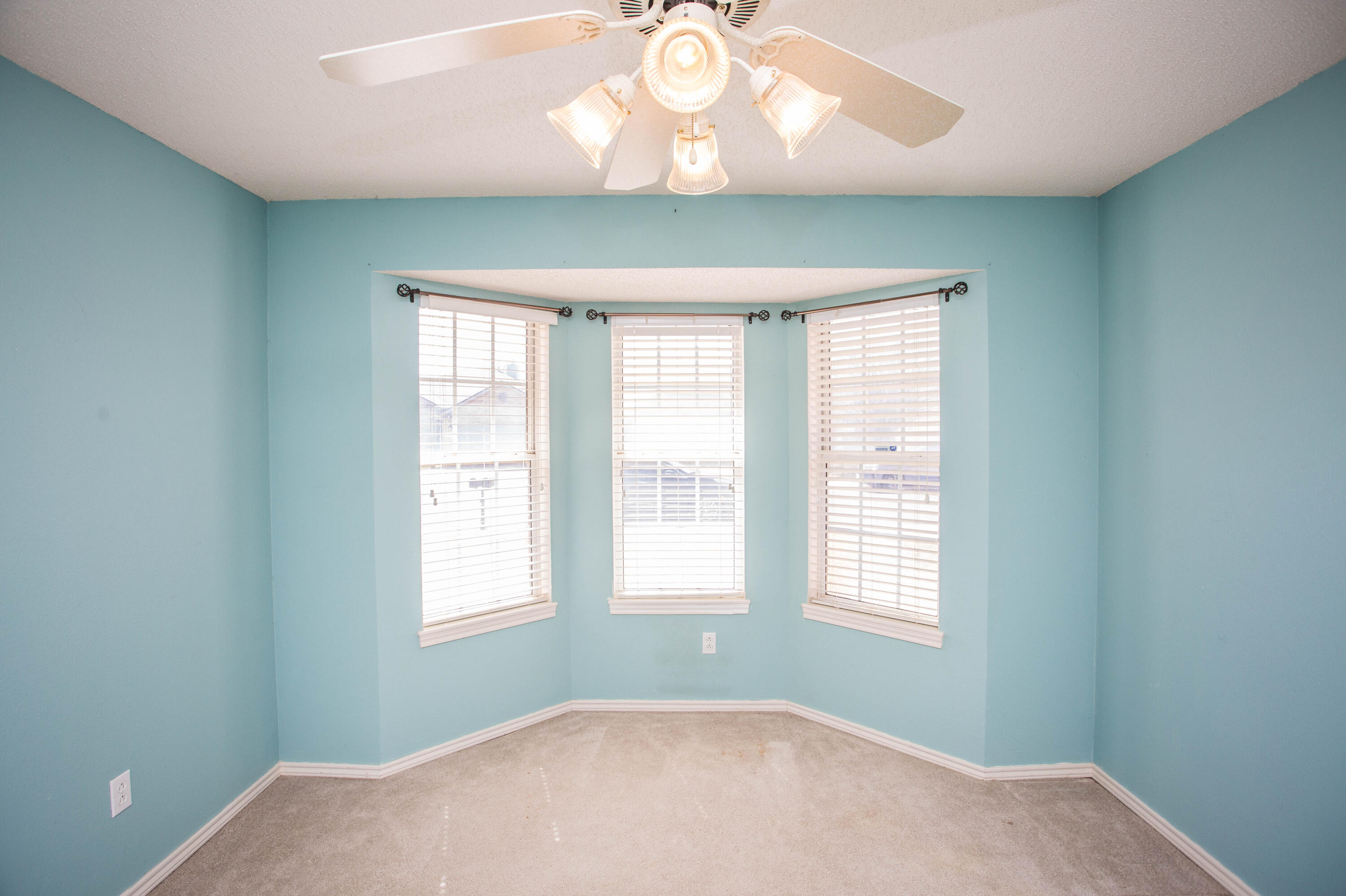 1904 76th Street Lubbock, TX 79423 - Photo 24 of 32 a bedroom with a bed and a window