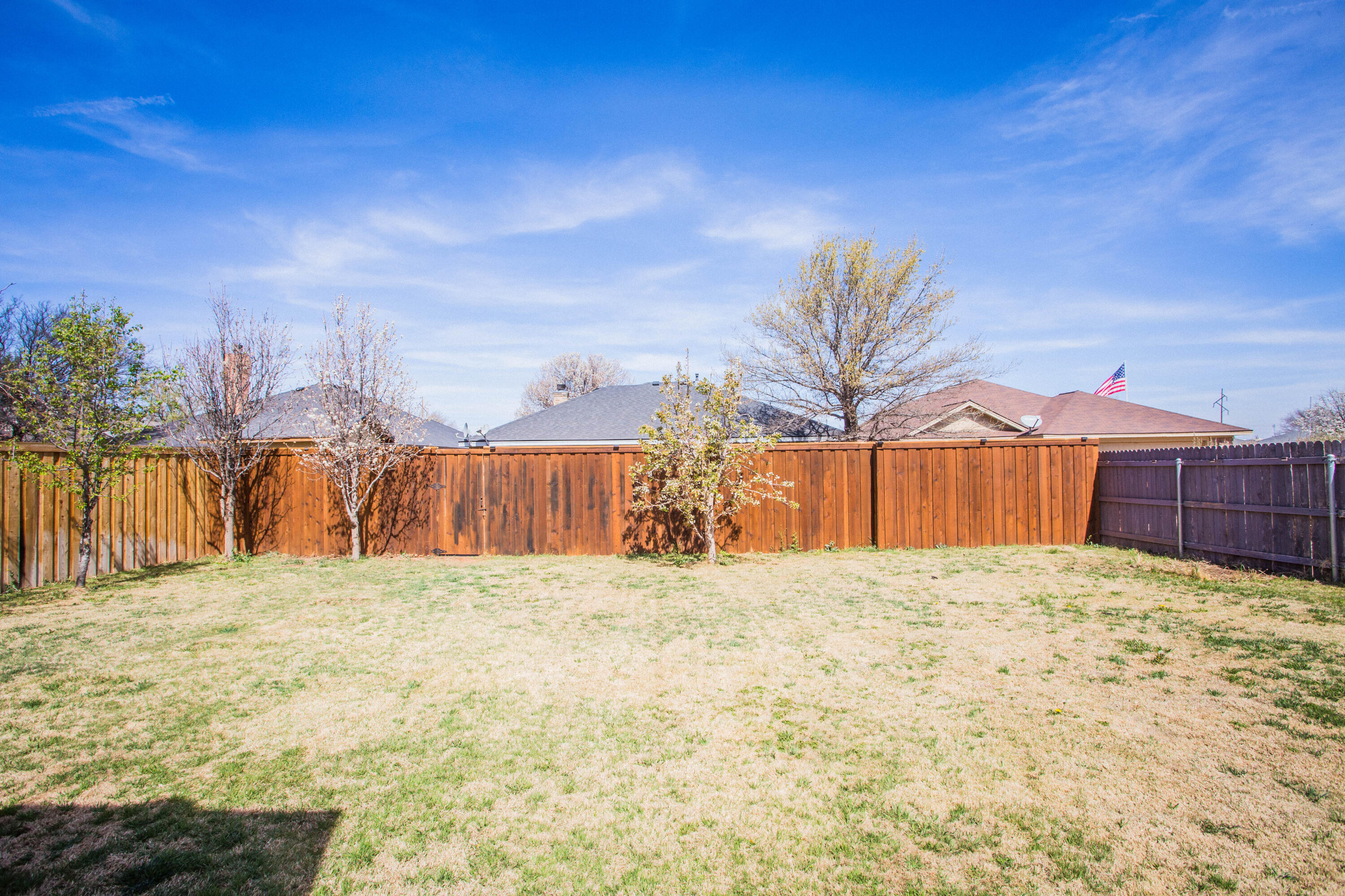 1904 76th Street Lubbock, TX 79423 - Photo 30 of 32 a view of a backyard of a house