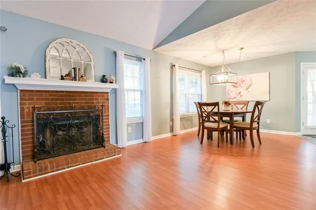 a view of a livingroom with furniture and a fireplace