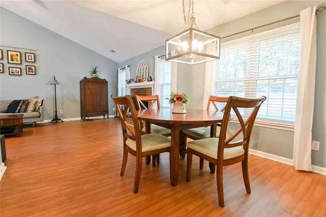a dining room with furniture and window