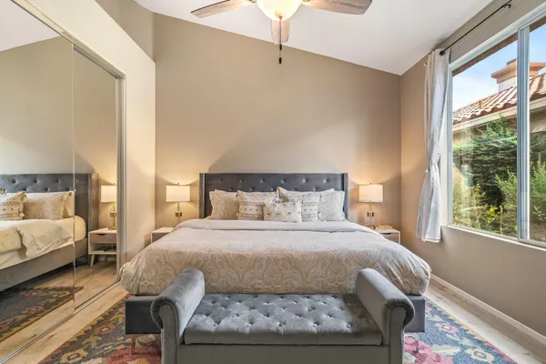 a bedroom with a bed and window