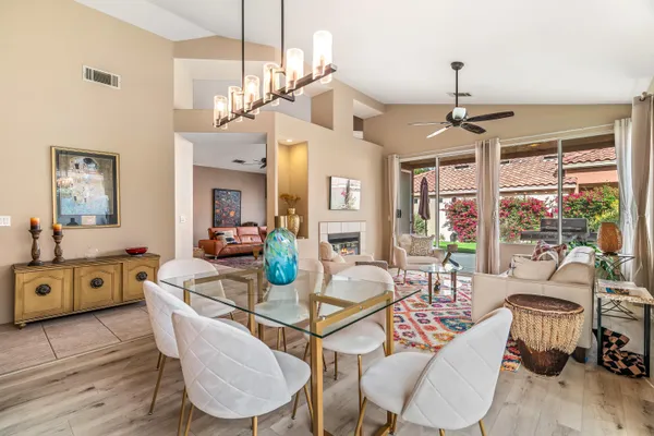 a view of a dining room with furniture window and wooden floor